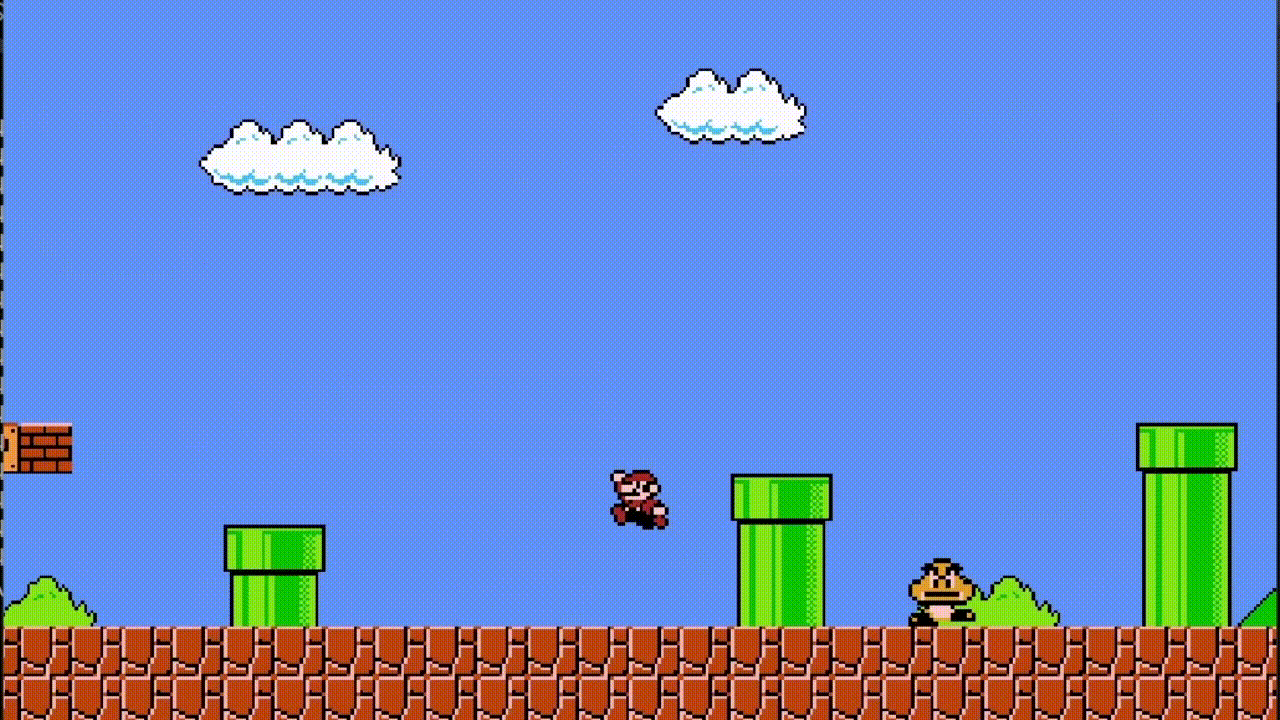 Mario jumping across a level with pipes, blocks, and a Goomba